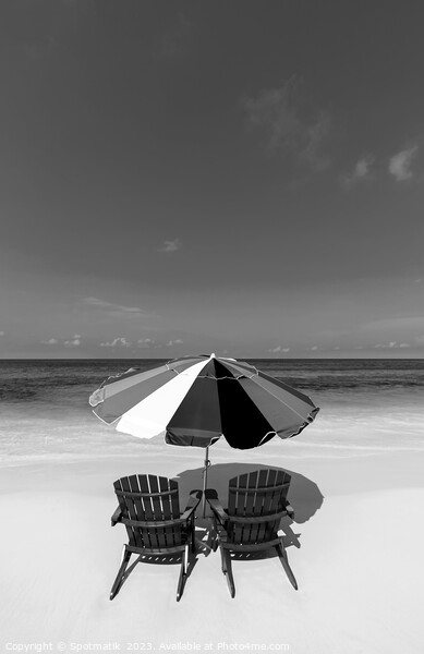 Bahamas beach umbrella and chairs on sandy beach  Picture Board by Spotmatik 
