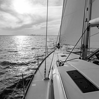 Buy canvas prints of Luxury yacht sailing towards distant horizon at sunset by Spotmatik 