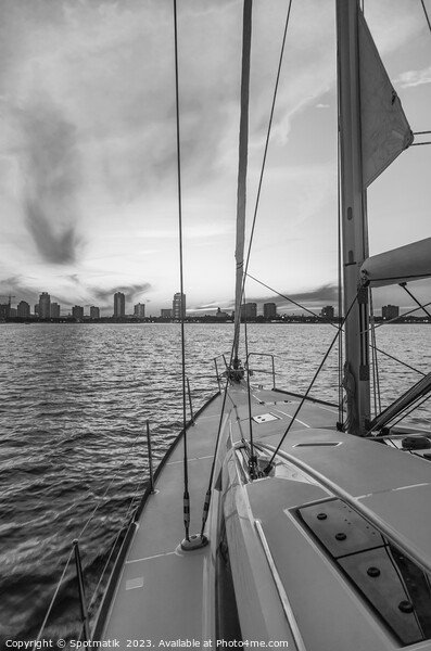 Sailing luxury yacht at sunset with cityscape view Picture Board by Spotmatik 