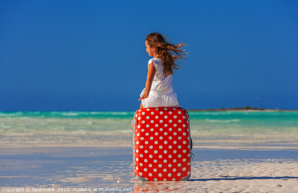 Girl sitting on red polka dot travel suitcase  Picture Board by Spotmatik 