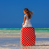 Buy canvas prints of Girl sitting on red polka dot travel suitcase  by Spotmatik 