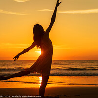 Buy canvas prints of Sunset view carefree young girl dancing on beach by Spotmatik 