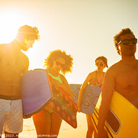 Buy canvas prints of Group of friends with bodyboards on beach vacation by Spotmatik 