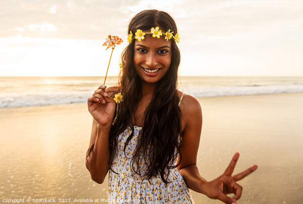 Freedom outdoors for smiling Indian girl by ocean Picture Board by Spotmatik 