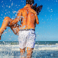 Buy canvas prints of Fun loving ethnic couple running in ocean waves by Spotmatik 