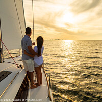 Buy canvas prints of Hispanic couple travelling on luxury yacht at sunset by Spotmatik 