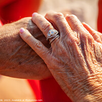 Buy canvas prints of Linked hands of senior Caucasian couple on vacation by Spotmatik 