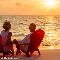 Buy canvas prints of Panoramic ocean view with mature couple sitting together by Spotmatik 