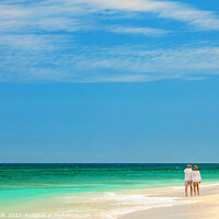 Buy canvas prints of Retired couple walking barefoot by turquoise ocean Bahamas by Spotmatik 