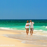 Buy canvas prints of Panoramic view retired couple walking by turquoise ocean by Spotmatik 