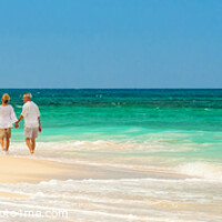 Buy canvas prints of Panoramic retired couple by ocean at island resort by Spotmatik 