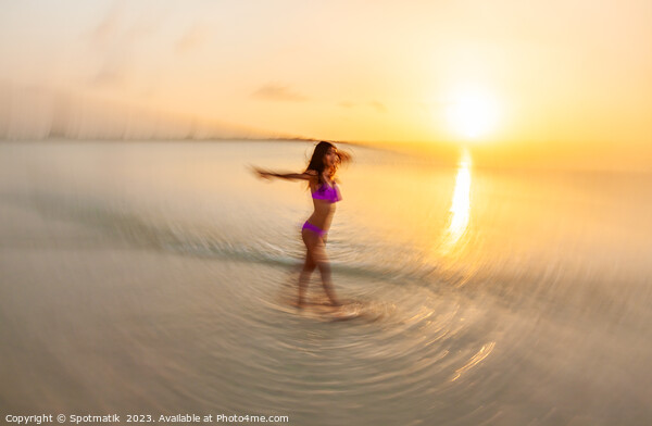 Motion blurred sunset ocean view with dancing female Picture Board by Spotmatik 