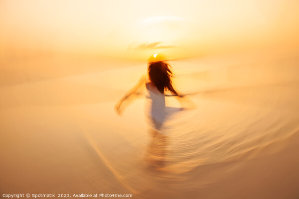 Motion blurred Asian girl dancing in ocean sunrise Picture Board by Spotmatik 