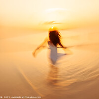 Buy canvas prints of Motion blurred Asian girl dancing in ocean sunrise by Spotmatik 
