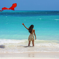 Buy canvas prints of Asian girl standing in ocean waves flying kite by Spotmatik 