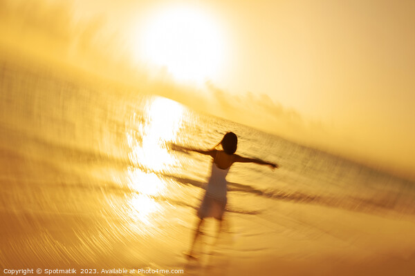 Motion blur Asian woman walking in ocean waves Picture Board by Spotmatik 
