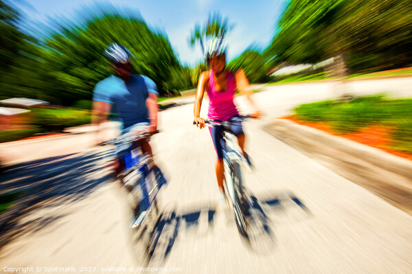 Afro American cyclists riding bikes in motion blur Picture Board by Spotmatik 