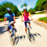 Buy canvas prints of Afro American cyclists riding bikes in motion blur by Spotmatik 