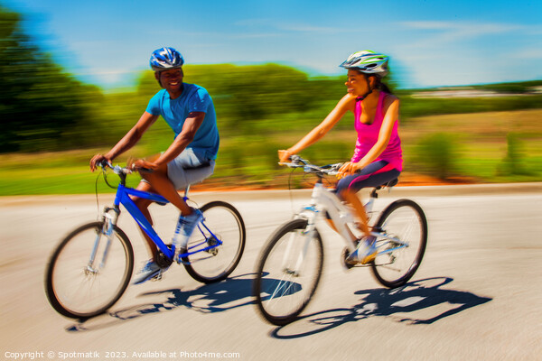 African American couple keeping fit riding bikes together Picture Board by Spotmatik 