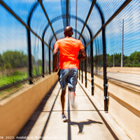 Buy canvas prints of Solo African American man running through covered walkway by Spotmatik 