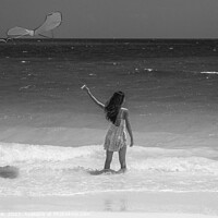 Buy canvas prints of Tropical ocean view with young woman flying kite by Spotmatik 