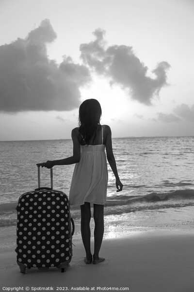 Young woman with suitcase enjoying tropical ocean sunrise Picture Board by Spotmatik 