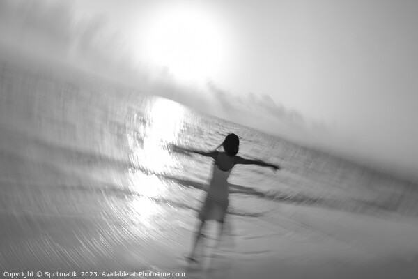 Motion blur carefree Asian female dancing on shoreline Picture Board by Spotmatik 
