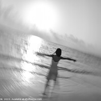 Buy canvas prints of Motion blur carefree Asian female dancing on shoreline by Spotmatik 