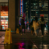 Buy canvas prints of Radio City Music Hall Street Shot With Reflection  by Benjamin Brewty