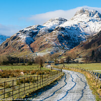 Buy canvas prints of Langdale pikes in winter Lake District National Park by Julian Carnell