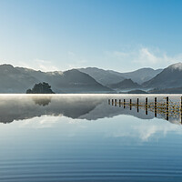 Buy canvas prints of Calm winter sunrise on Derwent water  by Julian Carnell