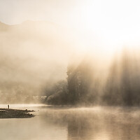 Buy canvas prints of Panorama misty Derwent Water with amazing sunrays by Julian Carnell