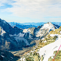 Buy canvas prints of Alpine climber on the summit of Dent Blanche by Julian Carnell