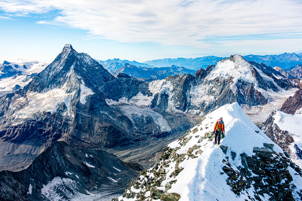 Alpine climbers on a mountain Picture Board by Julian Carnell