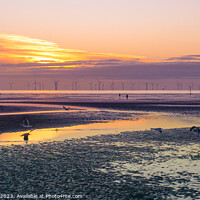 Buy canvas prints of Crosby Beach at sunset  by Lucy Norris