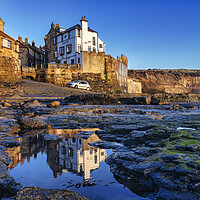 Buy canvas prints of Captivating Reflections of Robin Hoods Bay by Tim Hill