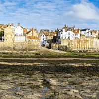 Buy canvas prints of Robin Hoods Bay Seafront Panoramic by Tim Hill