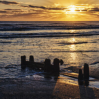 Buy canvas prints of Golden rays over tranquil Sandsend by Tim Hill