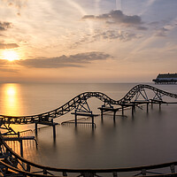 Buy canvas prints of Cleethorpes Beach Roller Coaster at Sunrise by Tim Hill