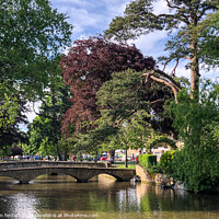 Buy canvas prints of Bourton on the water river windrush by Martin fenton
