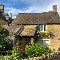 Buy canvas prints of Wishing well cottage Bourton on the water. by Martin fenton