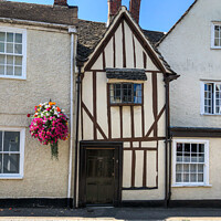 Buy canvas prints of Old timber framed house by Martin fenton