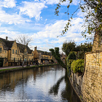 Buy canvas prints of Bourton on the water river reflections by Martin fenton