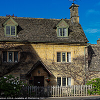 Buy canvas prints of Bourton on the water cottage  by Martin fenton