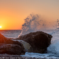 Buy canvas prints of Sea waves crushing and splashing on the rocks in beautiful warm  by Arthur Mustafa