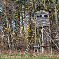 Buy canvas prints of Wooden lookout tower for hunting in the woods and on meadow by Lubos Chlubny