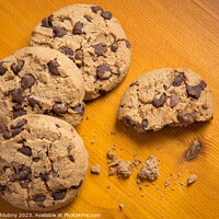 Buy canvas prints of Chocolate chip cookies on wood background. by Lubos Chlubny