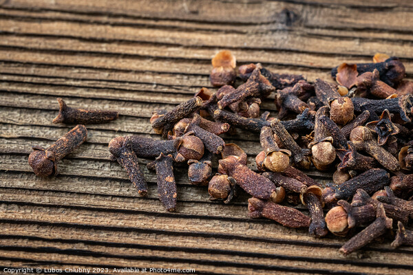Clove spice on a wooden board, Syzygium aromaticum Picture Board by Lubos Chlubny