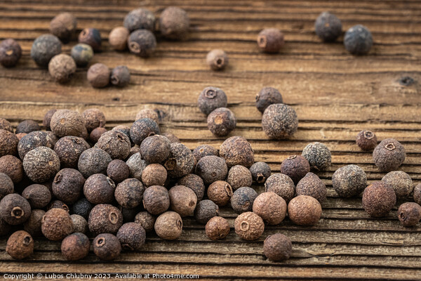 Allspice spice on wooden table Picture Board by Lubos Chlubny
