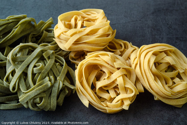 Fresh homemade green and yellow pasta tagliatelle. Raw homemade  Picture Board by Lubos Chlubny